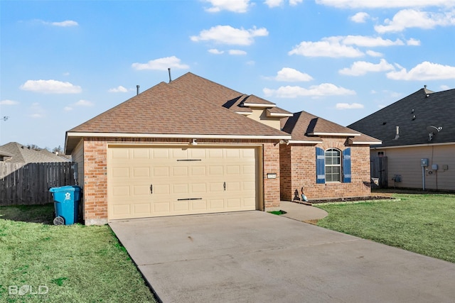 view of front of property featuring a garage and a front lawn