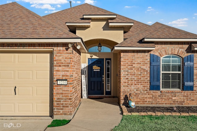 entrance to property featuring a garage