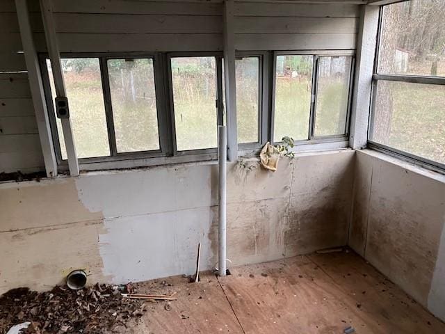 unfurnished sunroom with a healthy amount of sunlight