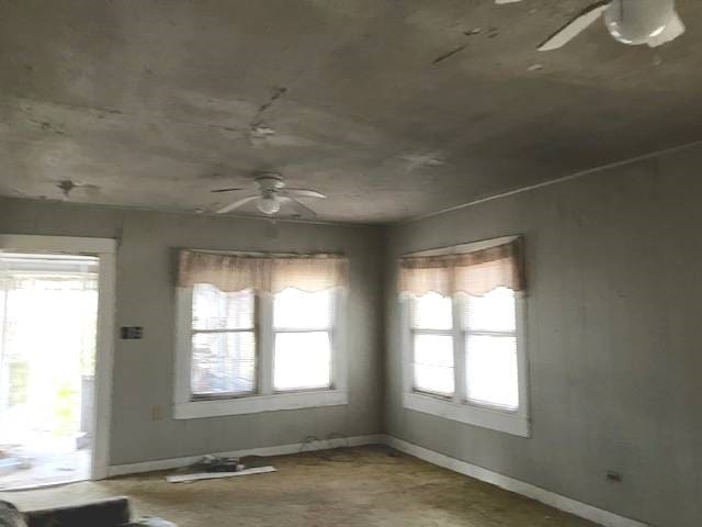 unfurnished dining area with ceiling fan