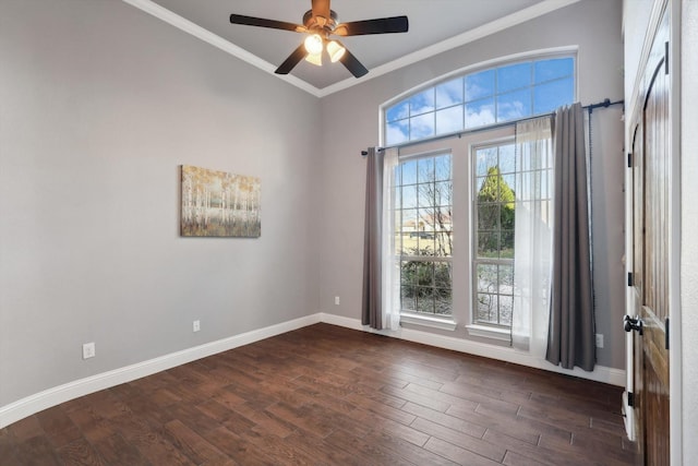 spare room featuring crown molding, dark hardwood / wood-style floors, and ceiling fan