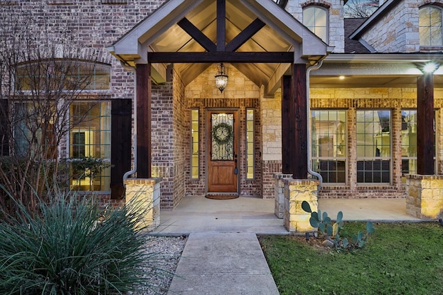 entrance to property featuring covered porch