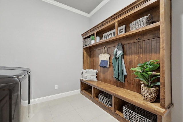 mudroom featuring ornamental molding, separate washer and dryer, and light tile patterned flooring