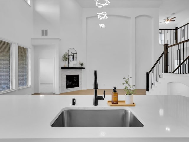 kitchen with a high ceiling and sink