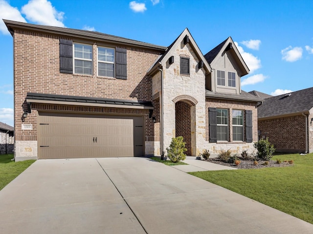 view of front facade with a garage, concrete driveway, stone siding, a front yard, and brick siding