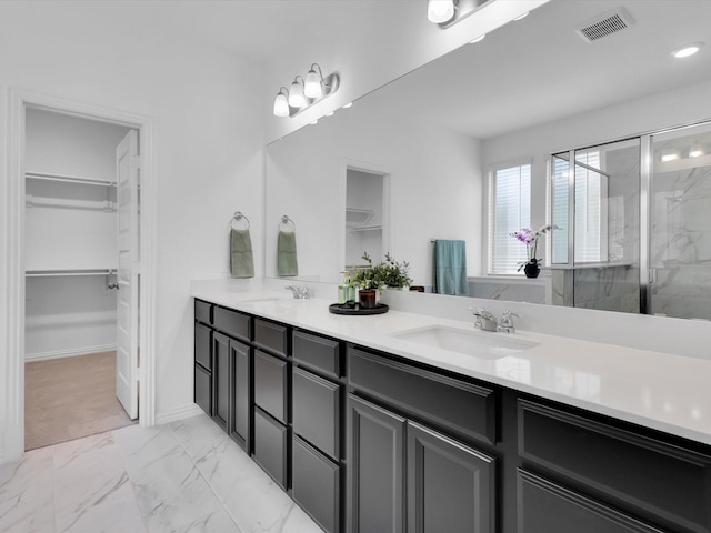 bathroom featuring vanity and walk in shower