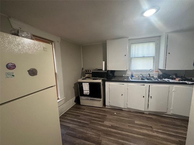 kitchen with white cabinetry, sink, white appliances, and dark wood-type flooring