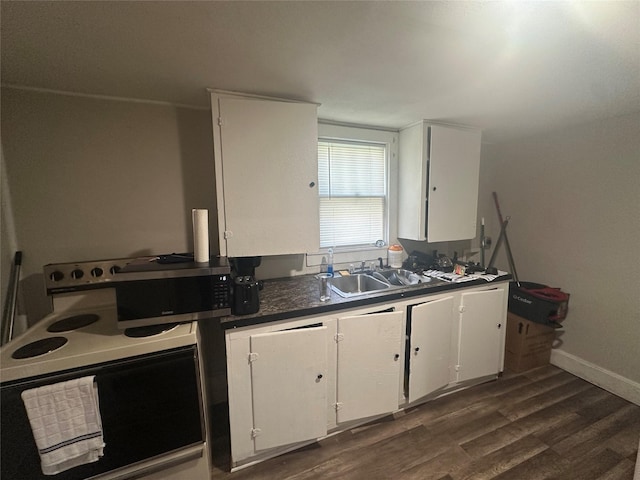 kitchen featuring range with electric cooktop, sink, white cabinets, and dark hardwood / wood-style flooring