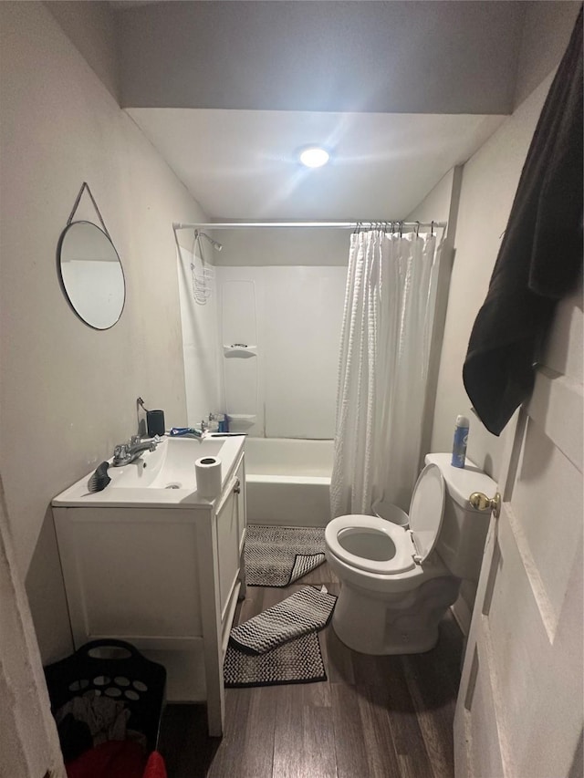 full bathroom featuring shower / tub combo with curtain, vanity, wood-type flooring, and toilet