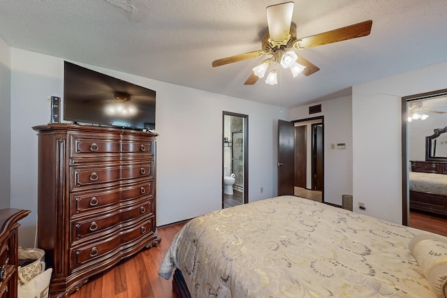 bedroom featuring ceiling fan, wood-type flooring, a textured ceiling, and ensuite bathroom