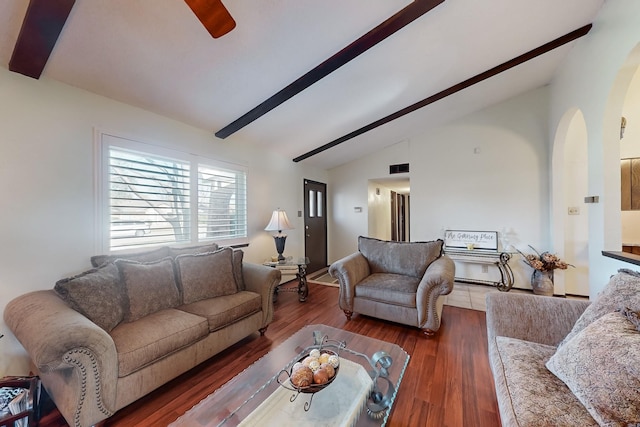 living room featuring vaulted ceiling with beams and dark wood-type flooring