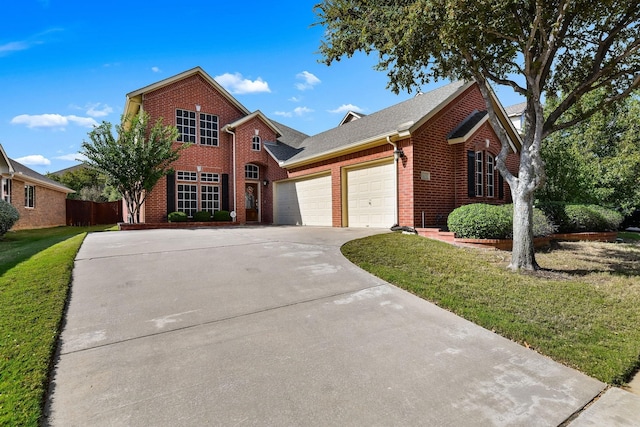 front of property with a garage and a front lawn