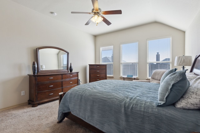 bedroom with lofted ceiling, light colored carpet, and ceiling fan