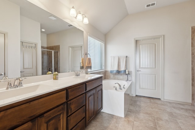 bathroom featuring vanity, tile patterned floors, lofted ceiling, and plus walk in shower