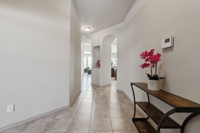 corridor featuring light tile patterned floors