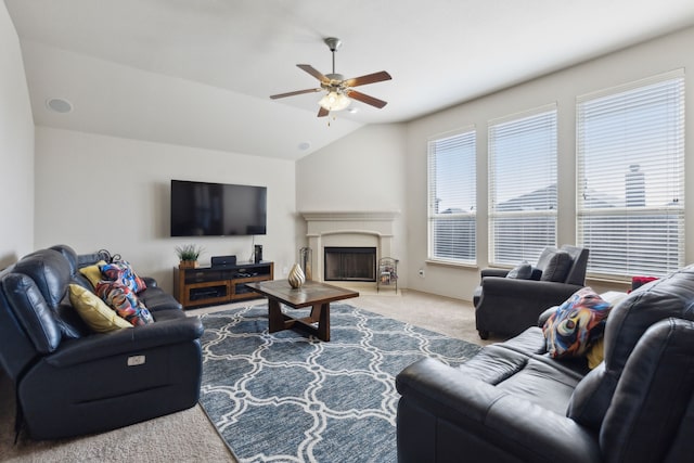 living room with vaulted ceiling, ceiling fan, and carpet