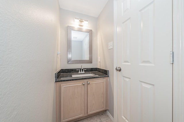 bathroom with vanity and tile patterned flooring