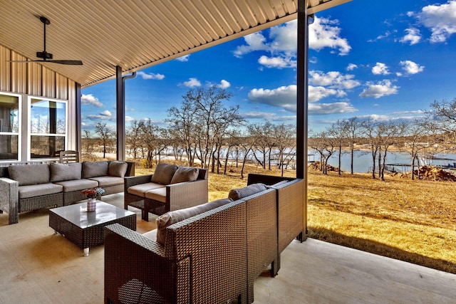 view of patio featuring an outdoor living space, a water view, and ceiling fan