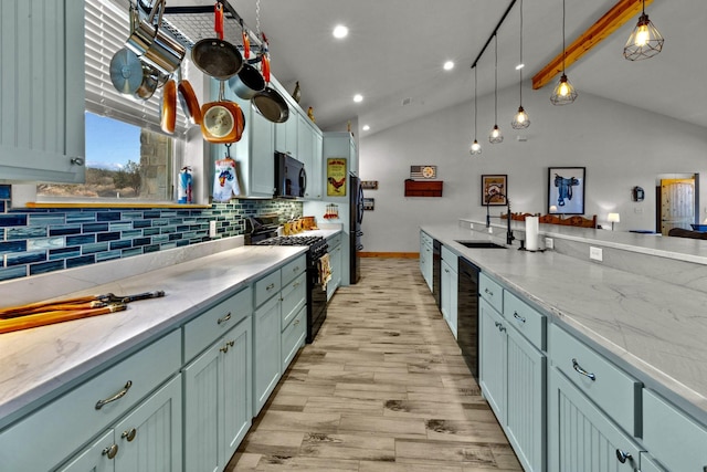 kitchen with pendant lighting, light hardwood / wood-style flooring, tasteful backsplash, black appliances, and lofted ceiling with beams