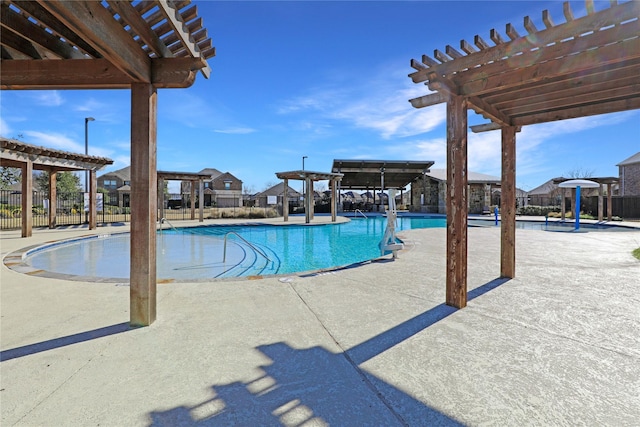 view of swimming pool featuring a pergola and a patio area