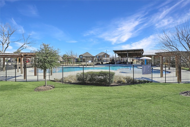 view of pool featuring a yard