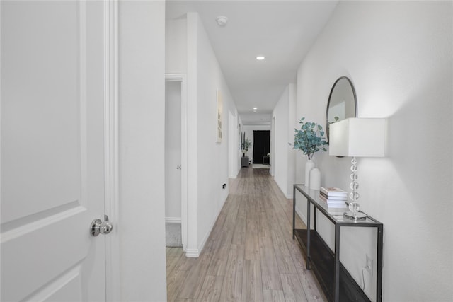 hall with light hardwood / wood-style floors