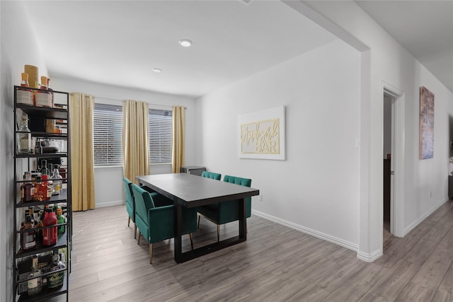 dining space with light wood-type flooring