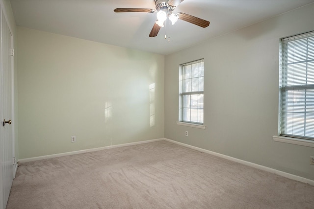 unfurnished room featuring ceiling fan and light colored carpet