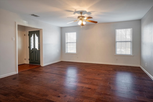 foyer entrance with dark hardwood / wood-style flooring and ceiling fan