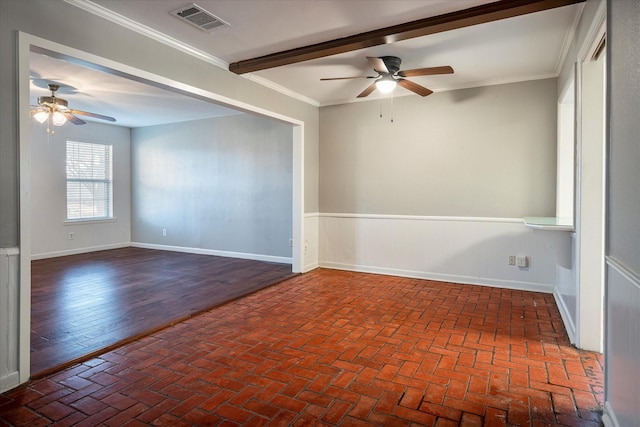 empty room with beam ceiling, ornamental molding, and ceiling fan