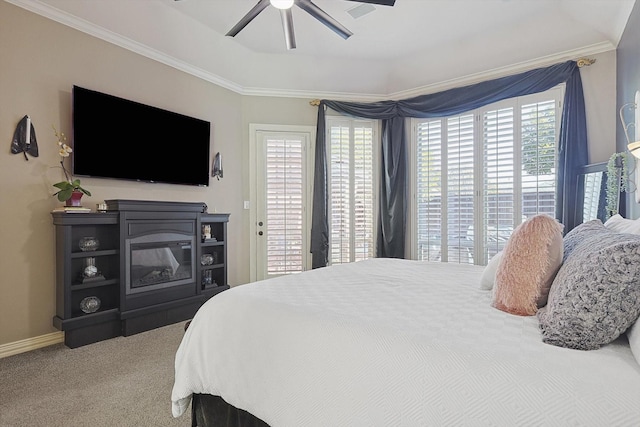 carpeted bedroom featuring ceiling fan, ornamental molding, multiple windows, and access to outside