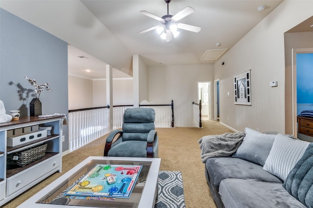 carpeted living room with ceiling fan