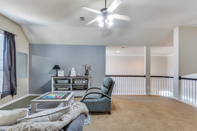 carpeted living room featuring vaulted ceiling and ceiling fan