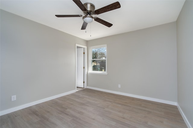 unfurnished room with ceiling fan and light wood-type flooring