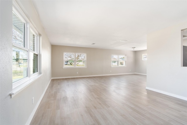 spare room with light wood-type flooring