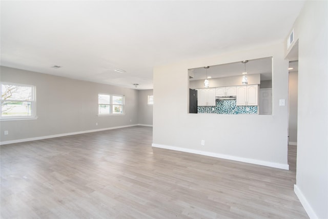 unfurnished living room featuring light hardwood / wood-style flooring