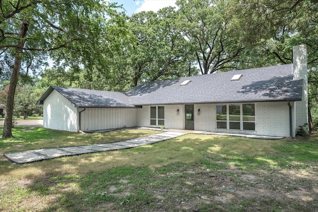 view of front of home with a front yard