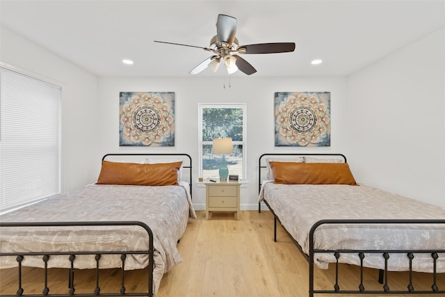 bedroom featuring ceiling fan and light wood-type flooring