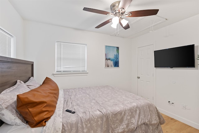 bedroom featuring wood-type flooring and ceiling fan