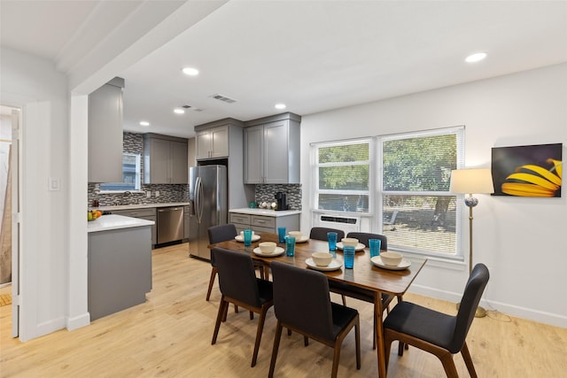 dining space featuring light hardwood / wood-style flooring