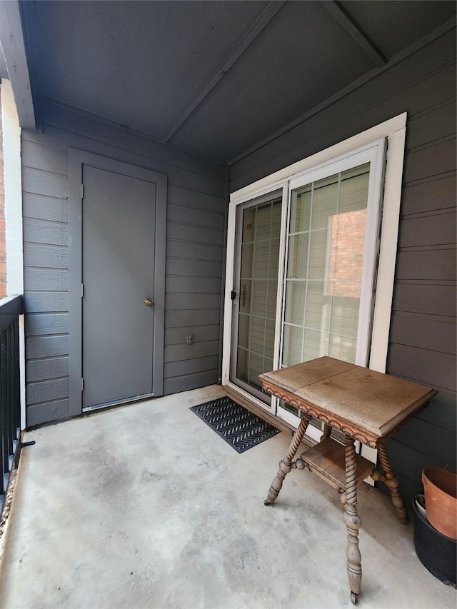 view of patio featuring a balcony