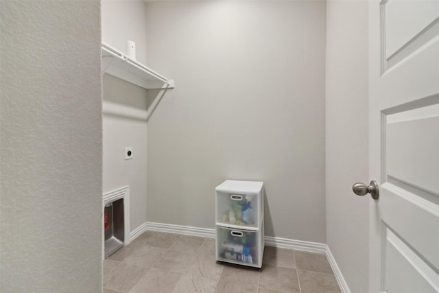 washroom with light tile patterned floors and electric dryer hookup