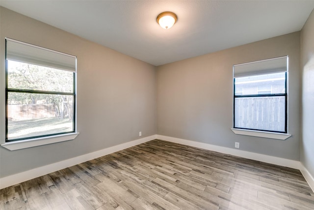 spare room featuring light hardwood / wood-style flooring