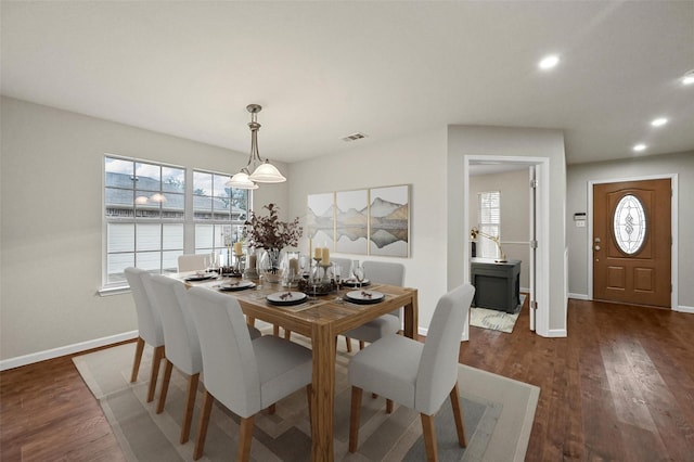 dining room with recessed lighting, dark wood finished floors, visible vents, and baseboards