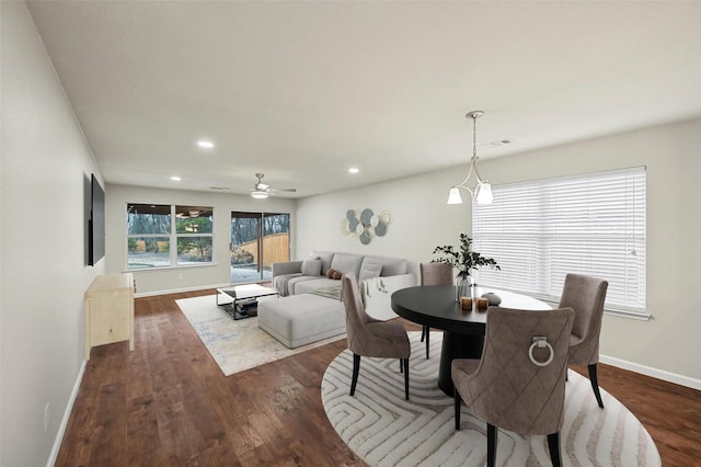 dining room featuring visible vents, baseboards, dark wood-style flooring, and recessed lighting