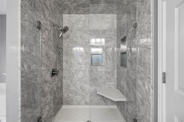 full bath with a shower stall