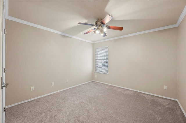 unfurnished room featuring ornamental molding, carpet floors, baseboards, and a ceiling fan