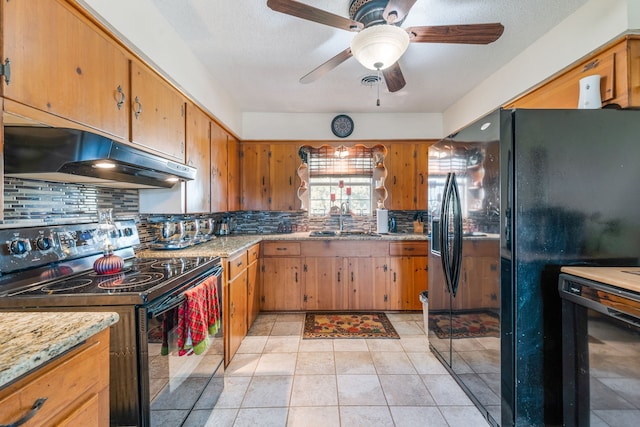 kitchen featuring sink, ceiling fan, backsplash, wine cooler, and black appliances