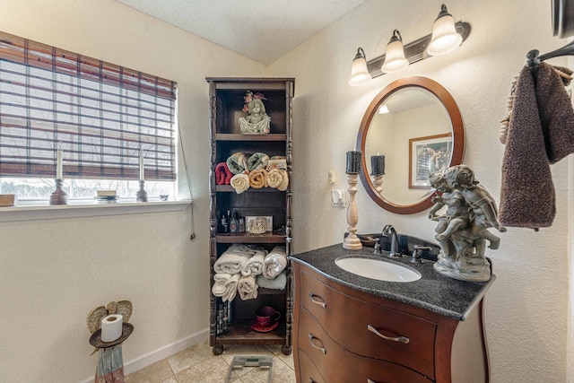 bathroom featuring tile patterned flooring and vanity