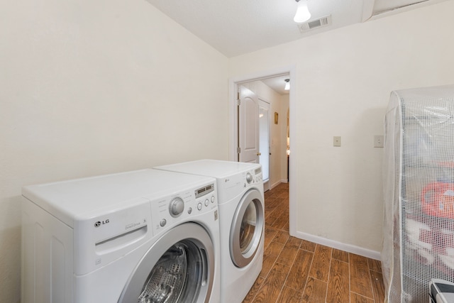 laundry room featuring washing machine and dryer